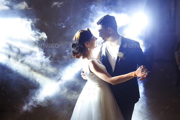 First Wedding Dance Of Newlywed Wedding Couple Dancing In The Darkness